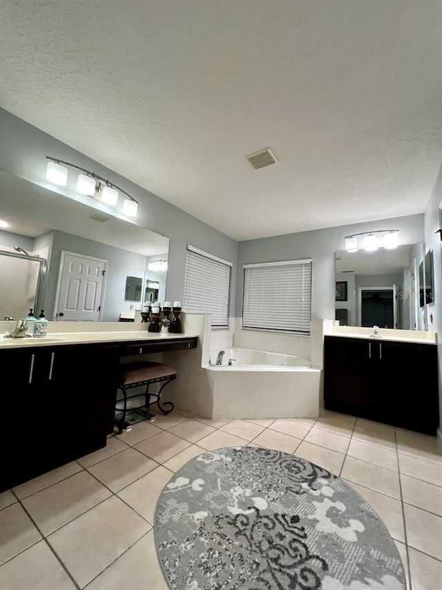 full bath featuring tile patterned floors, visible vents, a shower stall, and a garden tub