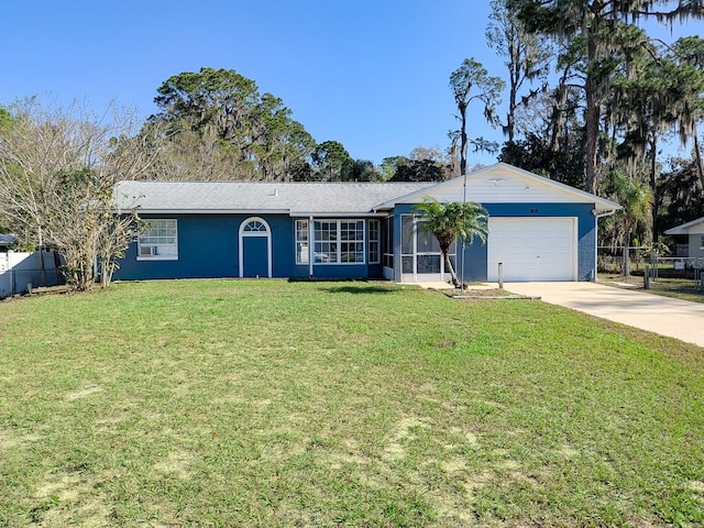 ranch-style home with a front lawn, concrete driveway, fence, and a garage