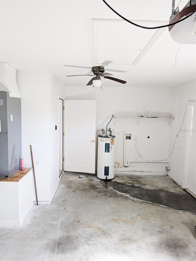 garage with heating unit, electric water heater, and ceiling fan