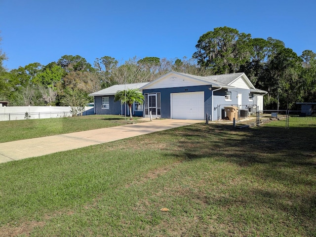 ranch-style house featuring a front yard, concrete driveway, an attached garage, and fence