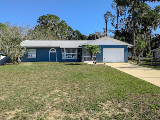 ranch-style home with a front lawn, stucco siding, driveway, a sunroom, and an attached garage