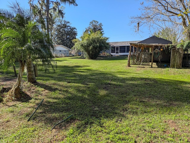 view of yard featuring a sunroom