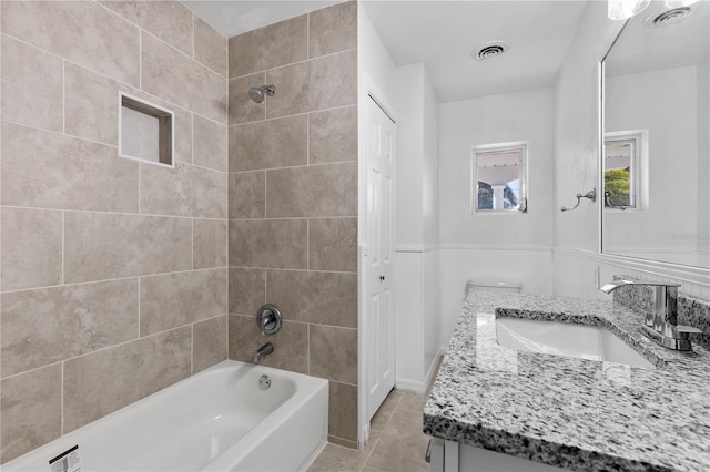 full bathroom with tile patterned floors, visible vents, bathing tub / shower combination, and vanity