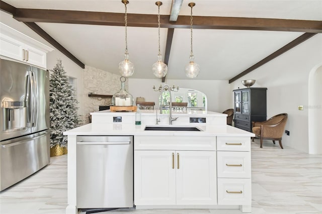 kitchen with vaulted ceiling with beams, marble finish floor, stainless steel appliances, and a sink