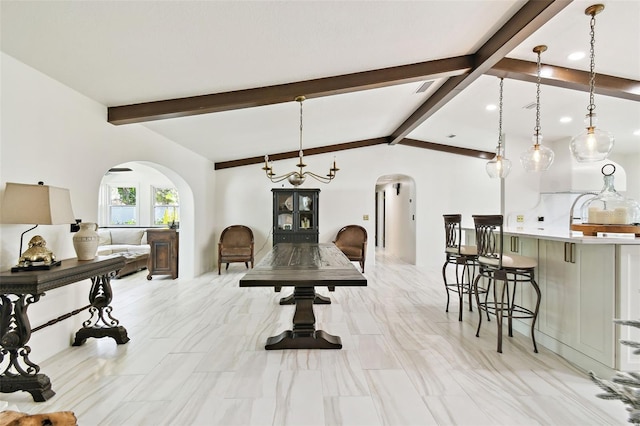 dining room featuring arched walkways, visible vents, and lofted ceiling with beams