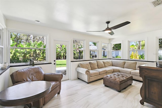 sunroom / solarium featuring visible vents and ceiling fan