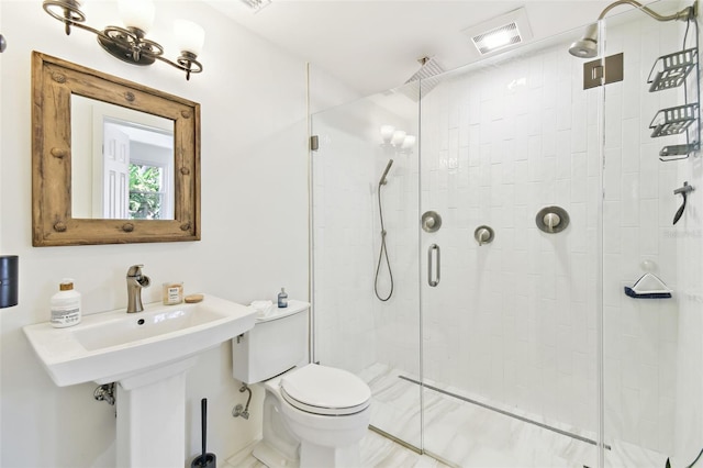 full bathroom with a shower stall, toilet, and visible vents