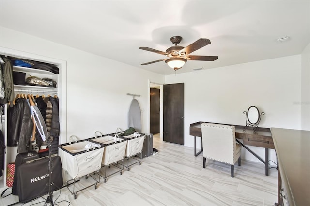 office area featuring visible vents and ceiling fan