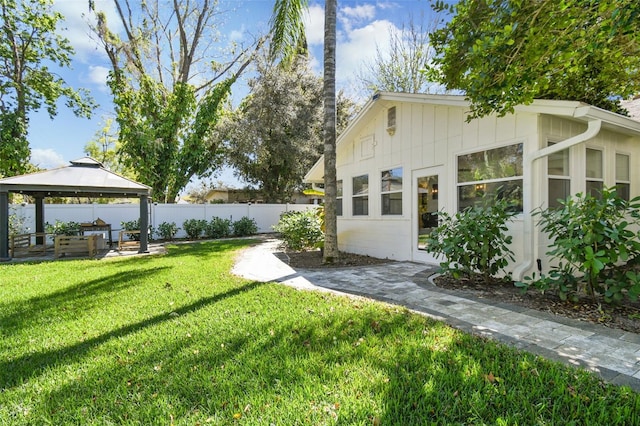 view of yard with a gazebo and fence