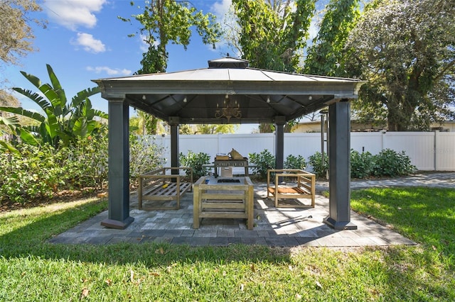 view of patio / terrace with a gazebo and fence