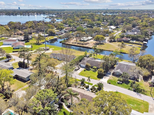 drone / aerial view featuring a residential view and a water view