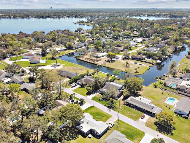 drone / aerial view featuring a residential view and a water view