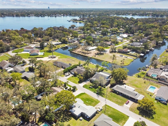 aerial view featuring a residential view and a water view