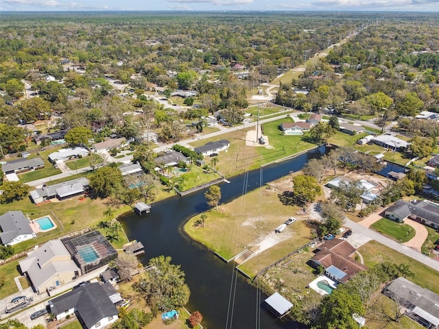 drone / aerial view with a residential view and a water view