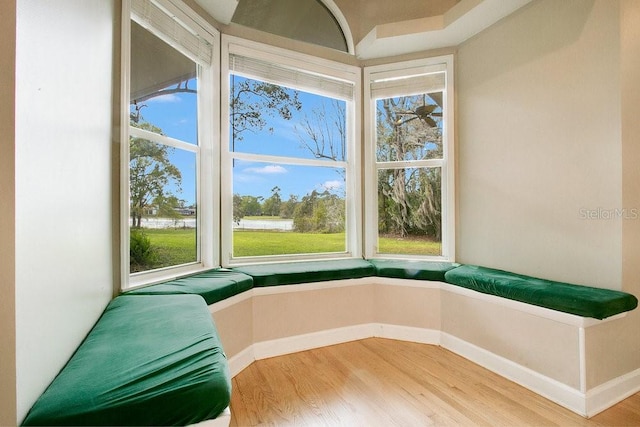 sitting room with baseboards and light wood-style floors