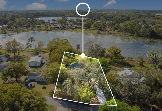 aerial view with a view of trees and a water view