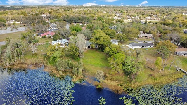 bird's eye view with a forest view and a water view