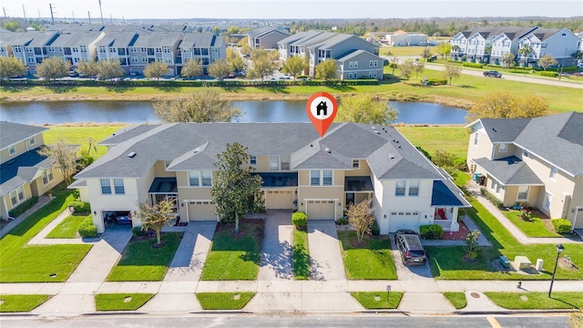 aerial view featuring a residential view and a water view