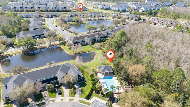 bird's eye view featuring a residential view and a water view