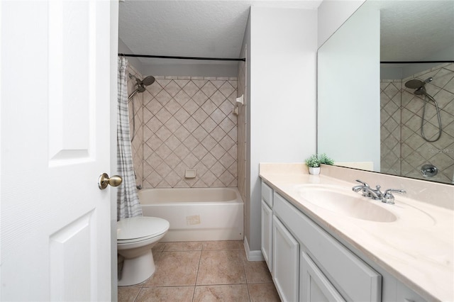 bathroom with toilet, vanity, shower / bath combo, tile patterned floors, and a textured ceiling