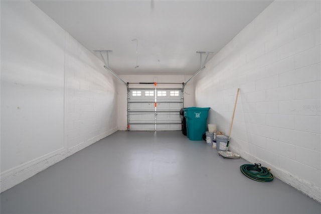 garage featuring concrete block wall