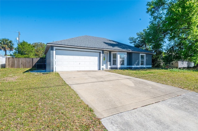 ranch-style home featuring stucco siding, driveway, fence, a front yard, and a garage