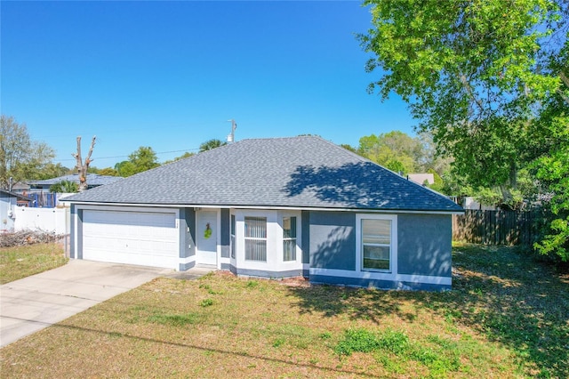 single story home featuring roof with shingles, concrete driveway, a front yard, and fence