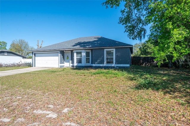 ranch-style home with a front yard, fence, driveway, stucco siding, and a garage