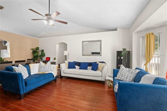 living room with arched walkways, ceiling fan, lofted ceiling, and wood tiled floor