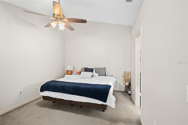 carpeted bedroom featuring ceiling fan, baseboards, and lofted ceiling