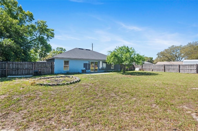 view of yard featuring a patio area and a fenced backyard