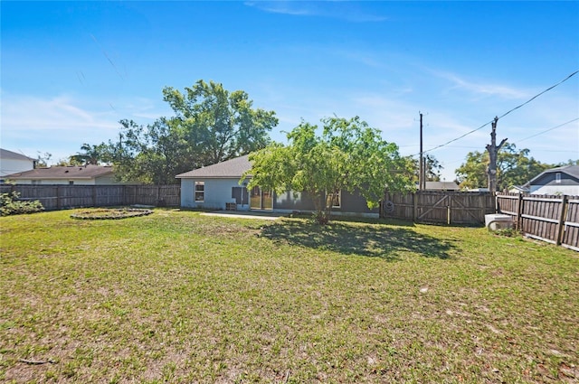 view of yard with a patio area and a fenced backyard