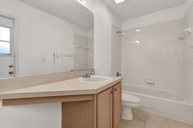 full bath featuring tile patterned floors, shower / washtub combination, toilet, and vanity