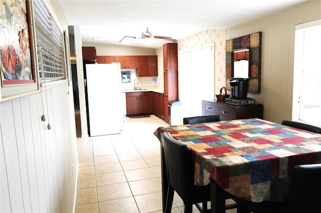 dining room with light tile patterned floors and ceiling fan