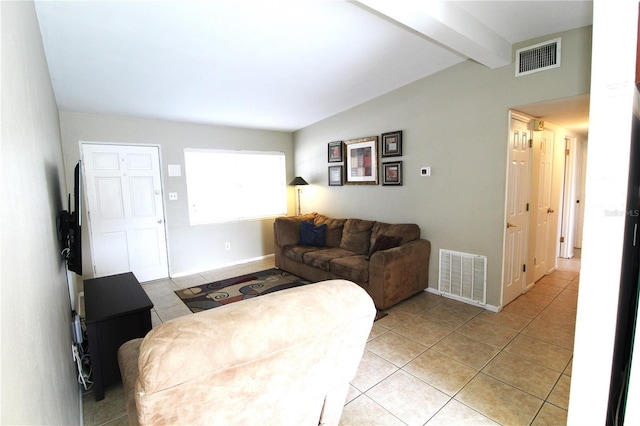 living room with light tile patterned floors, visible vents, vaulted ceiling with beams, and baseboards