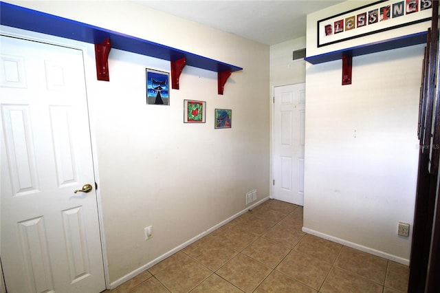 interior space featuring visible vents, baseboards, and tile patterned flooring