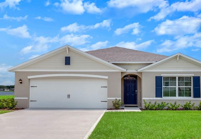 ranch-style home with stucco siding, a front lawn, roof with shingles, concrete driveway, and an attached garage