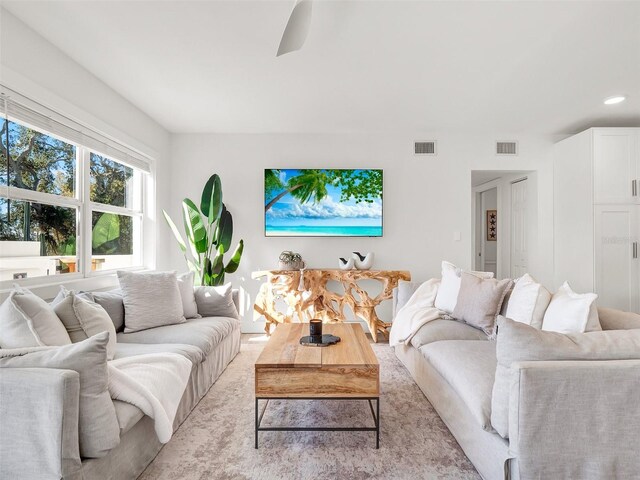 living room with recessed lighting and visible vents