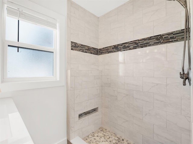 bathroom featuring tiled shower