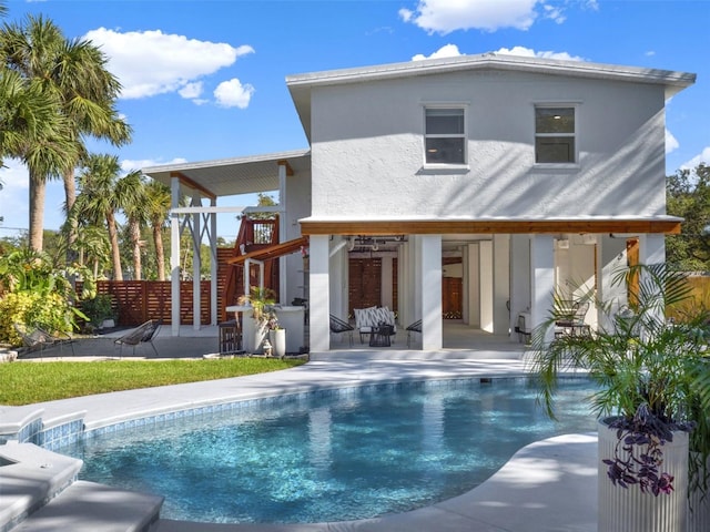 back of house with a fenced in pool, a patio, and fence