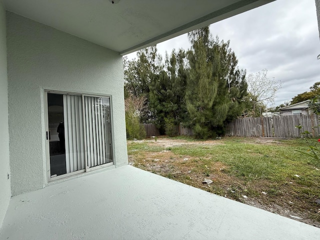 view of yard with a patio area and fence