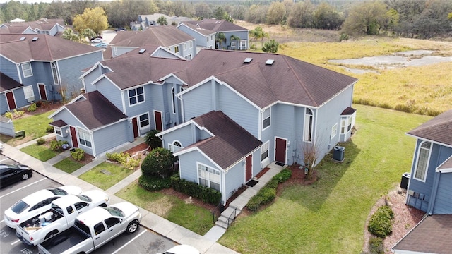 birds eye view of property with a residential view