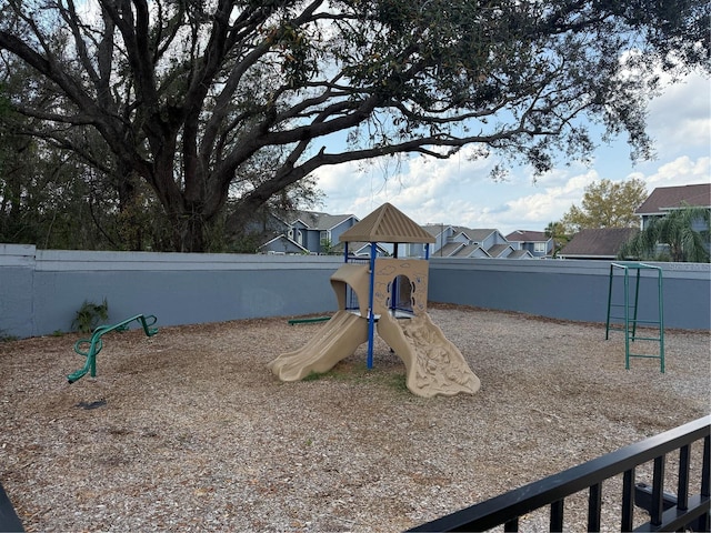 view of play area featuring fence