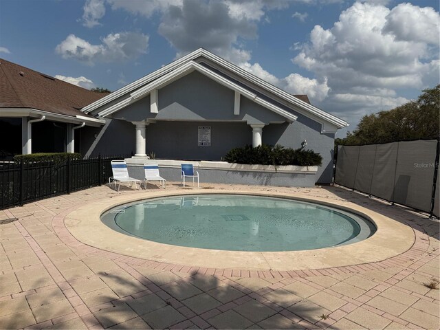 view of pool featuring a fenced in pool, a patio, and fence