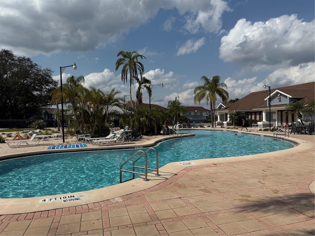 373 Caribbean Dr, Davenport, FL 33897 - community pool with a patio area