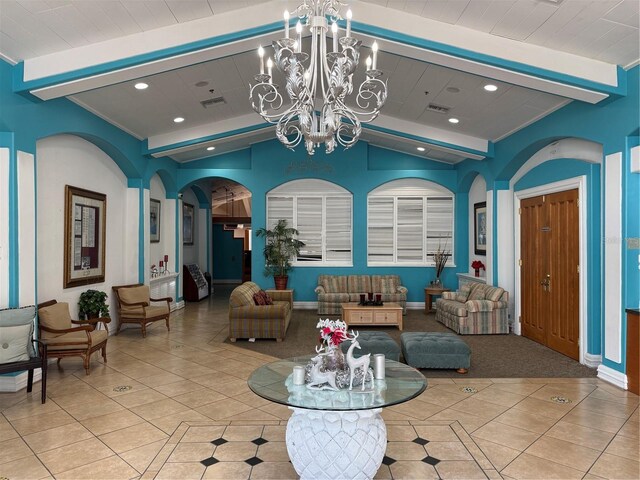 373 Caribbean Dr, Davenport, FL 33897 - living area featuring tile patterned floors, a chandelier, recessed lighting, arched walkways, and baseboards