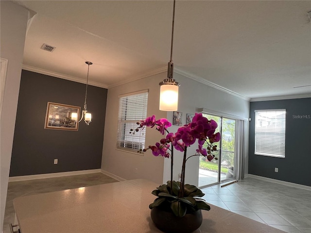 interior space featuring visible vents, crown molding, and baseboards