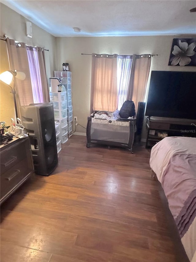 bedroom with wood finished floors