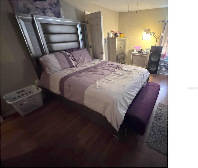 bedroom featuring wood finished floors