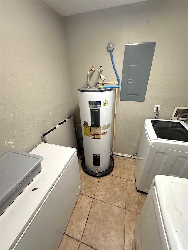 laundry area with electric panel, water heater, separate washer and dryer, light tile patterned flooring, and laundry area